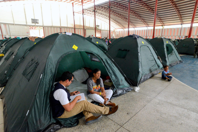 Venezuelan Woman in tent with child